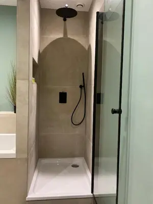 a shower in a bathroom with a glass door at Luxury Prinsengracht Canal House Jordan Area in Amsterdam