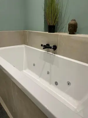 a white bath tub with a faucet in a bathroom at Luxury Prinsengracht Canal House Jordan Area in Amsterdam