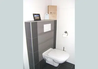 a small bathroom with a white toilet in it at watervilla-albertje in Amsterdam