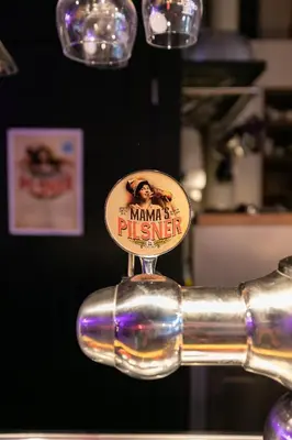 a chrome pole with a sign that says miami physics at ClinkMama in Amsterdam
