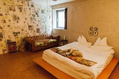 a bedroom with a bed and a couch in it at ClinkMama in Amsterdam