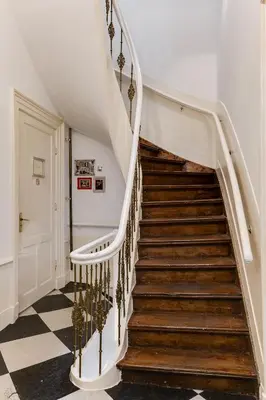 a staircase in a home with white railings at ClinkCoco in Amsterdam