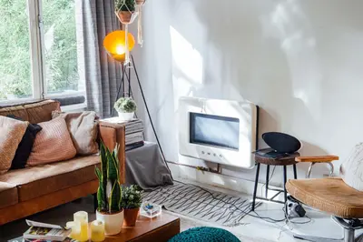 a living room with a couch and a tv at ClinkCoco in Amsterdam