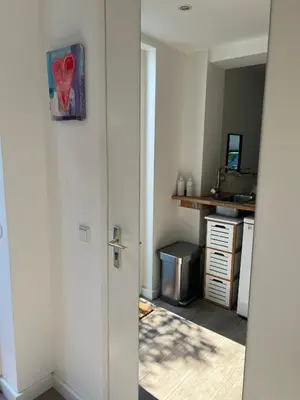 an open door to a kitchen with a desk at Chalet Parfait in Bergen