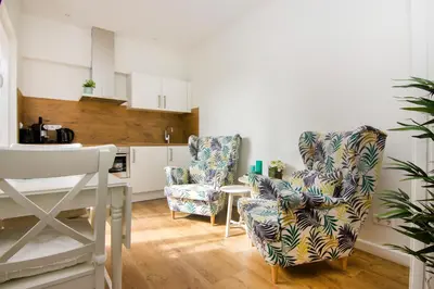a kitchen with two chairs and a table at Lou-Lou in Zandvoort