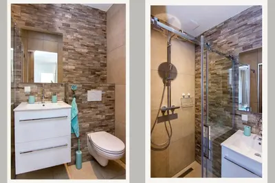 a bathroom with a toilet sink and a shower at Lou-Lou in Zandvoort