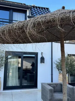 a roof of a house with a tree at appartementen zeespiegel in Zandvoort