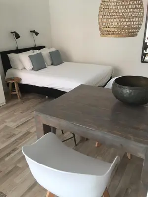 a living room with a table and a couch at appartementen zeespiegel in Zandvoort