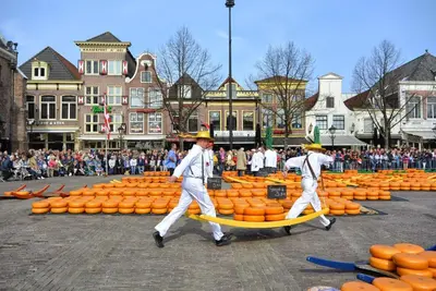 a group of men walking through a display of pumpkins at Goditi La Vita in Hem