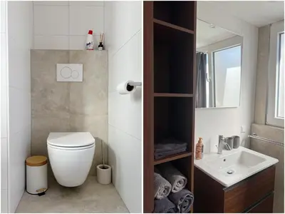 a bathroom with a toilet and a sink at Oudegracht Alkmaar in Alkmaar
