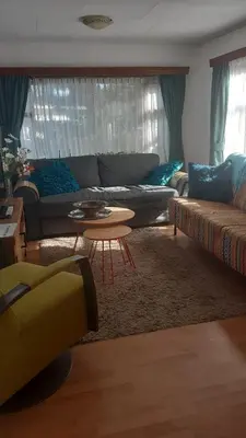 a living room with a couch and a table at kitty