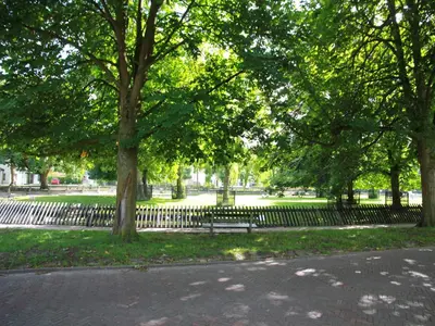 a park with a bench and trees in a park at Comfortable Holiday Home in Bergen in Bergen