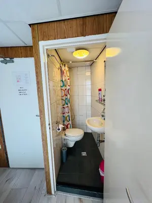 a bathroom with a toilet and a sink at Hotel Sharm in Amsterdam