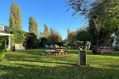 a park with a picnic table in the grass at Marenhoeve in Houten