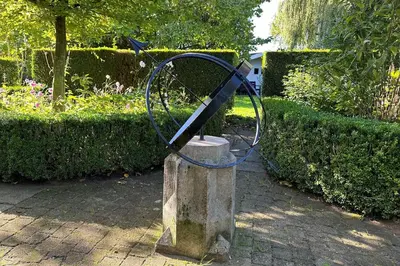 a metal object sitting on top of a stone statue at Marenhoeve in Houten