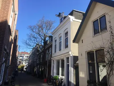 a white building on the side of a street at B&B Numero 14 in Amsterdam