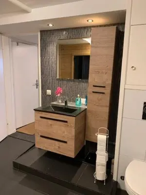 a bathroom with a sink and a mirror at B&B Zeespiegel in Zandvoort