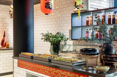 a buffet line with food on display in a restaurant at Corendon Urban Amsterdam Schiphol Airport Hotel in Badhoevedorp