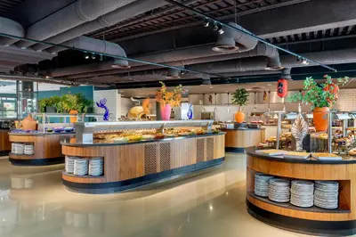 a restaurant with a bunch of food on display at Corendon Urban Amsterdam Schiphol Airport Hotel in Badhoevedorp