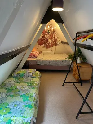 a room with two bunk beds in a attic at SOEPP hotel & restaurant in Alkmaar