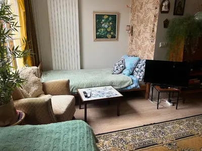 a living room with two couches and a tv at SOEPP hotel & restaurant in Alkmaar
