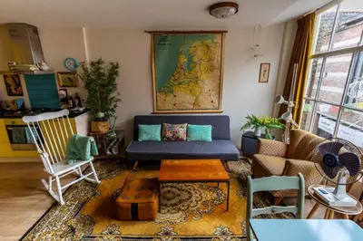 a living room with a couch and a table at SOEPP hotel & restaurant in Alkmaar
