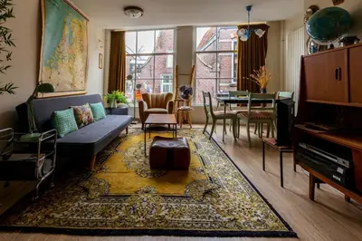 a living room with a couch and a table at SOEPP hotel & restaurant in Alkmaar