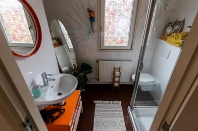 a small bathroom with a sink and a toilet at SOEPP hotel & restaurant in Alkmaar