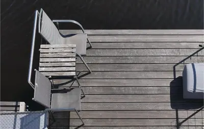 a set of stairs with a chair in a stadium at Aquacabin in Aalsmeer