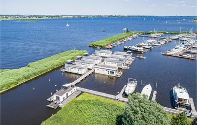 an aerial view of a marina with boats in the water at Aqualiving in Aalsmeer