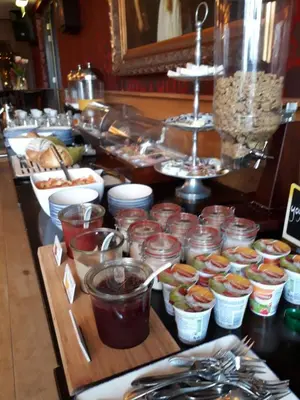 a buffet line with many different types of food at Hotel Restaurant de Engel in Lisse