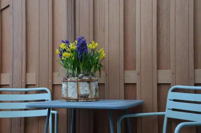 a blue table with a vase of flowers on it at Hotel Restaurant de Engel in Lisse