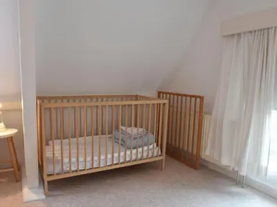 a baby room with two cribs and a window at Apartment Bergen aan Zee near Beach in Bergen aan Zee