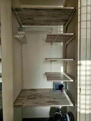 a room with wooden shelves in a room at Zandvoort at Home I Free parking & Airco in Zandvoort