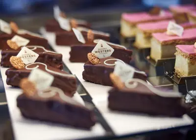 a display of chocolate desserts on a table at Hotel Jakarta Amsterdam in Amsterdam