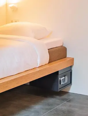 a bedroom with a bed on a wooden platform at Bunk Hotel Utrecht in Utrecht