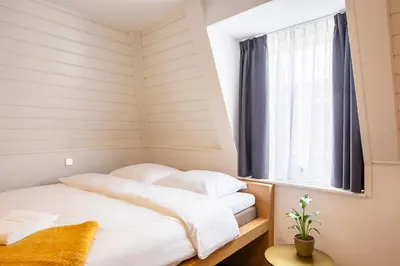 a bed in a room with a window at Bunk Hotel Utrecht in Utrecht