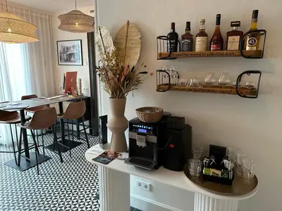 a kitchen with a counter with a coffee maker on it at Boutique hotel Margretha in Zandvoort