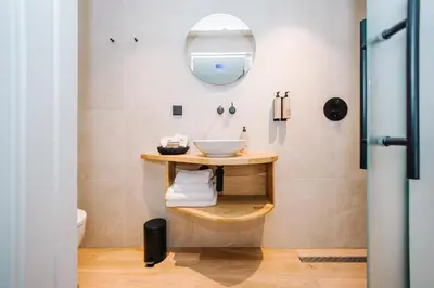 a bathroom with a sink and a mirror at Boutique hotel Margretha in Zandvoort