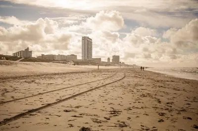a view of a beach with buildings in the background at Apartment Seastar Zandvoort in Zandvoort