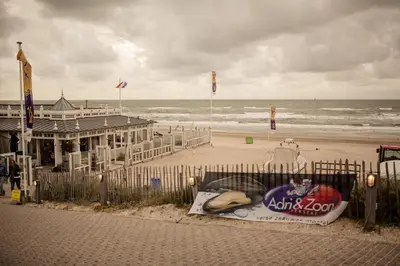 a building on the beach with a surfboard on it at Apartment Seastar Zandvoort in Zandvoort