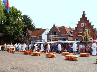 a group of people walking around a street with orange baskets at Apartment Seastar Zandvoort in Zandvoort