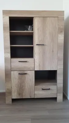a wooden cabinet with four drawers in a room at Quiet spacious room in Amsterdam