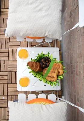 a plate of food with bread and eggs on a table at kustappartementenkatwijk in Katwijk aan Zee