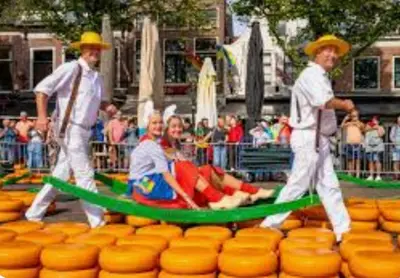 a group of men pulling a man in a raft at Huisje Britt met grote tuin en veel privacy in Dirkshorn