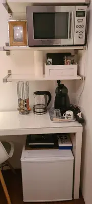 a white desk with a microwave and a blender at Mi BnB Amsterdam in Amsterdam