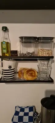 a refrigerator with a shelf with donuts in it at Mi BnB Amsterdam in Amsterdam