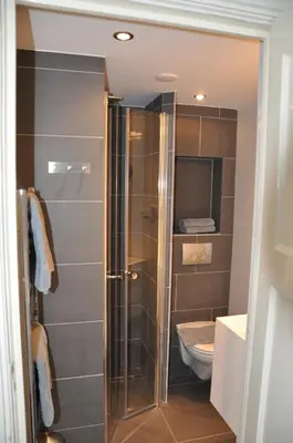 a bathroom with a shower and a toilet at Schelvis Apartments in Zandvoort