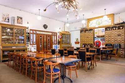a dining room with wooden tables and chairs at De Rijper Eilanden in De Rijp