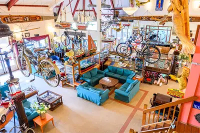a room filled with lots of bikes hanging from the ceilings at De Rijper Eilanden in De Rijp